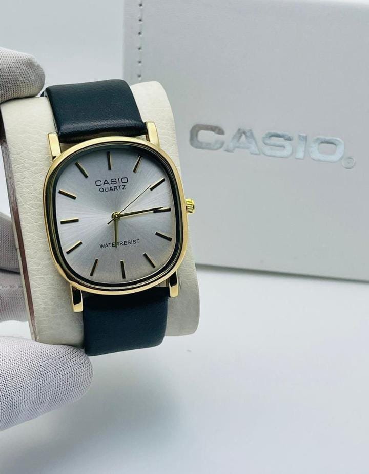 Gold with Green strap white dial